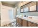 Bathroom with a vanity, drawers, mirror, and a shower/tub with patterned curtain at 45 Wright Ct, Lakewood, CO 80228