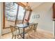 Well-lit dining area with hardwood floors, large window, and modern light fixture, ideal for Gathering meals at 45 Wright Ct, Lakewood, CO 80228