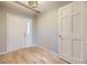 Bright entryway with hardwood floors, a decorative light fixture, and a coat closet at 45 Wright Ct, Lakewood, CO 80228