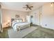 Spacious main bedroom with a ceiling fan, and access to ensuite bathroom at 45 Wright Ct, Lakewood, CO 80228