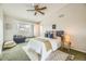 Bedroom with a large window, ceiling fan, a window seat and neutral decor at 45 Wright Ct, Lakewood, CO 80228