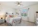 Serene bedroom with large window, neutral walls, and stylish furnishings at 10818 Cimarron St # 1102, Firestone, CO 80504