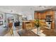 Inviting kitchen with wood cabinets, stainless steel appliances, and open layout to living spaces at 10818 Cimarron St # 1102, Firestone, CO 80504