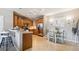 Bright eat-in kitchen featuring wood cabinets, stainless steel appliances, and natural light at 10818 Cimarron St # 1102, Firestone, CO 80504