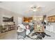 Open-concept living room with neutral walls, stylish furniture, and ample natural light at 10818 Cimarron St # 1102, Firestone, CO 80504