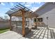 Inviting backyard features pergola, seating, outdoor kitchen, and string lights at 1960 Wabash St, Denver, CO 80220