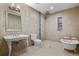 Luxurious bathroom with soaking tub, shower, and unique tile design at 1960 Wabash St, Denver, CO 80220