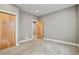 Comfortable bedroom with carpet, stylish wood doors, and neutral walls at 1960 Wabash St, Denver, CO 80220