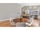 This dining area has a round table with seating and a stylish view into the kitchen at 1960 Wabash St, Denver, CO 80220