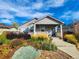 Charming house with welcoming porch, neat landscaping and a well-maintained exterior at 1960 Wabash St, Denver, CO 80220