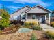 Inviting single-Gathering home featuring a charming porch, attractive landscaping, and a freshly painted exterior at 1960 Wabash St, Denver, CO 80220