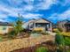 Inviting home exterior featuring a landscaped yard with decorative rock and mulch, and a pathway leading to the charming entrance at 1960 Wabash St, Denver, CO 80220