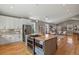 Open-concept kitchen with an island, stainless steel appliances, and access to the living room at 1960 Wabash St, Denver, CO 80220