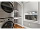 The laundry room features new stacked washer and dryer at 1960 Wabash St, Denver, CO 80220