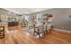 Stylish living room boasting an open layout, hardwood floors, and elegant furnishings, with a view into the modern kitchen at 1960 Wabash St, Denver, CO 80220