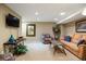 Cozy finished basement with carpet floors, entertainment center, and comfortable seating at 2 S Monroe St, Denver, CO 80209