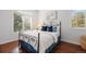 Well-lit bedroom featuring hardwood floors, large windows, and comfortable furnishings at 2 S Monroe St, Denver, CO 80209
