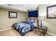 Cozy bedroom with a floral comforter, bedside table, and soft lighting at 2 S Monroe St, Denver, CO 80209