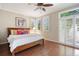 Bright and airy bedroom with hardwood floors, large windows, and cozy decor at 2 S Monroe St, Denver, CO 80209