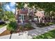 Classic brick facade with well-manicured landscaping and inviting porch at 2 S Monroe St, Denver, CO 80209
