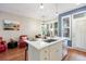 Bright kitchen featuring a modern island, updated appliances and breakfast nook at 2 S Monroe St, Denver, CO 80209