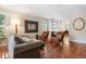 Inviting living room with a fireplace, comfortable seating and hardwood floors at 2 S Monroe St, Denver, CO 80209