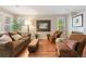 Cozy living room featuring hardwood floors, neutral paint, and abundant natural light at 2 S Monroe St, Denver, CO 80209