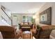 Living room showcasing staircase, hardwood floors, plantation shutters and comfortable seating at 2 S Monroe St, Denver, CO 80209