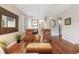 Inviting living room with a fireplace, hardwood floors, two chairs, and elegant decor at 2 S Monroe St, Denver, CO 80209