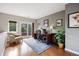 Well-lit office space with hardwood floors, desk, and balcony access at 2 S Monroe St, Denver, CO 80209