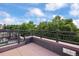 Spacious roof deck with black metal railings provides an ideal spot for relaxation and outdoor entertainment at 2 S Monroe St, Denver, CO 80209