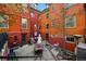 Charming brick backyard featuring patio seating, garden area and outdoor gathering space at 1165 N Pennsylvania St # G2, Denver, CO 80203