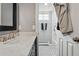 Bathroom featuring a white tiled tub and modern vanity at 1165 N Pennsylvania St # G2, Denver, CO 80203