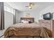 Comfortable bedroom with a wooden headboard and a large dresser at 1165 N Pennsylvania St # G2, Denver, CO 80203
