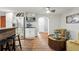 Eat-in kitchen featuring stainless steel appliances and dark countertops and hardwood flooring at 1165 N Pennsylvania St # G2, Denver, CO 80203