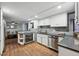 Contemporary kitchen with stainless steel appliances, granite countertops, and an open view to the living area at 1165 N Pennsylvania St # G2, Denver, CO 80203