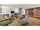 Cozy living room features a brick fireplace, comfortable seating, and wood flooring at 1165 N Pennsylvania St # G2, Denver, CO 80203