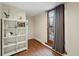 Bright office space with wood floors, natural light, and a built-in bookshelf at 1165 N Pennsylvania St # G2, Denver, CO 80203