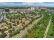 Spacious neighborhood with green lawns, mature trees, sidewalks and paved roads with stunning city views in the background at 4850 E Kentucky Ave # C, Denver, CO 80246