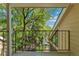 Balcony view of lush greenery and a glimpse of the neighborhood at 4850 E Kentucky Ave # C, Denver, CO 80246