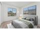 Bedroom with a large window, plush carpet, and stylish decor at 4850 E Kentucky Ave # C, Denver, CO 80246
