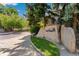 Stone Cedar Pointe sign surrounded by mature trees and landscaping welcomes you to the community at 4850 E Kentucky Ave # C, Denver, CO 80246