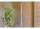 Exterior view of a unit entrance with a front door and greenery nearby at 4850 E Kentucky Ave # C, Denver, CO 80246