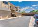 Another view of the garages, with stairways leading to upper floors and ample parking space at 4850 E Kentucky Ave # C, Denver, CO 80246