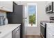 Bright kitchen features stainless steel appliances and a window at 4850 E Kentucky Ave # C, Denver, CO 80246