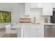 Bright kitchen features stainless steel appliances and breakfast bar at 4850 E Kentucky Ave # C, Denver, CO 80246