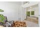 Living room with hardwood floors transitioning to carpet, and lots of natural light at 4850 E Kentucky Ave # C, Denver, CO 80246