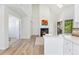 Living room adjacent to the kitchen features a fireplace and balcony access at 4850 E Kentucky Ave # C, Denver, CO 80246