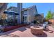 Outdoor patio featuring a stone fire pit, Adirondack chairs, and an umbrella-covered dining table at 14533 W 69Th Pl, Arvada, CO 80004