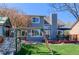 Inviting backyard featuring a spacious deck and playground, perfect for outdoor enjoyment and Gathering activities at 14533 W 69Th Pl, Arvada, CO 80004
